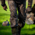 Load image into Gallery viewer, Gamehide Elimitick AeroFlex Pant - Lifestyle 1 - Mossy Oak New Bottomland