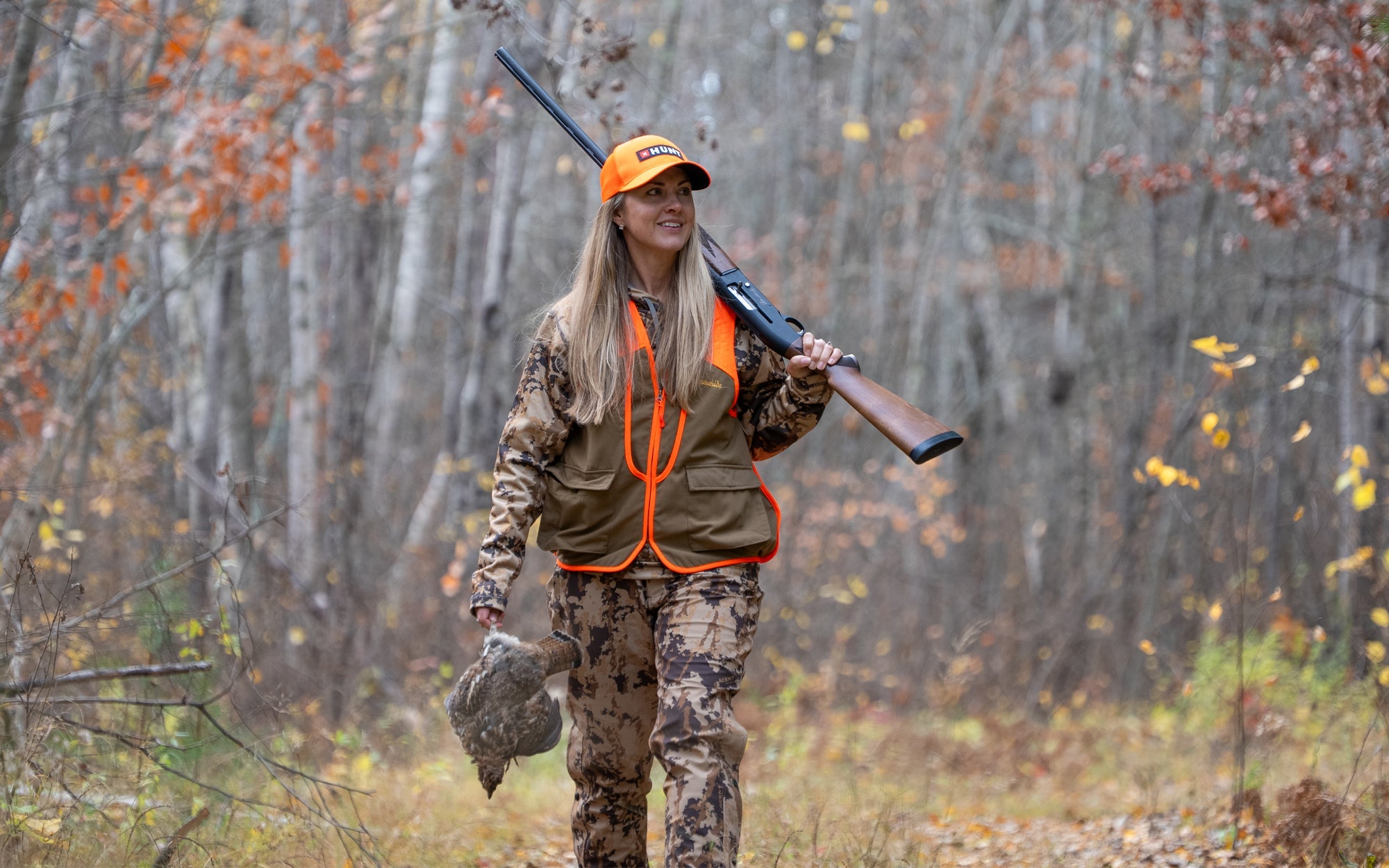woman hunter glassing on ridge with binoculars