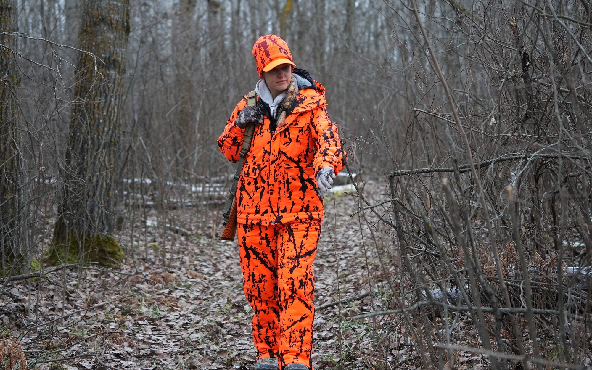 Hunter in blaze orange camo hunting clothing