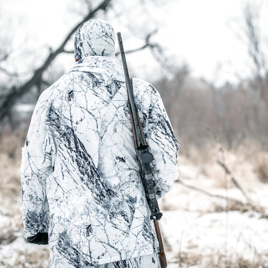 walking to set in naked north snow camo clothing