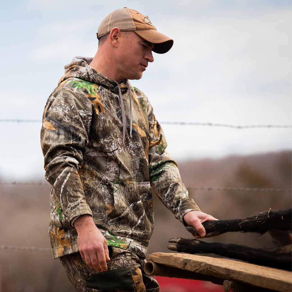 hunter wearing gamehide top in realtree